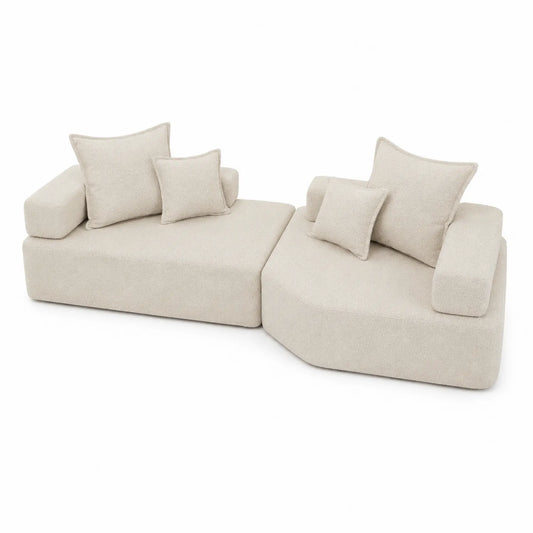 Sofá modular de tela bouclé beige con cojines